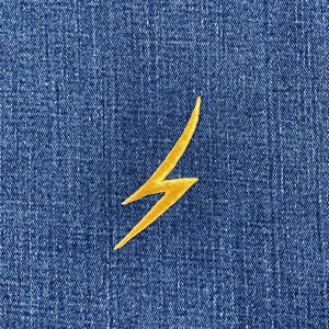 May include: A gold lightning bolt embroidered on a blue denim background. The bolt is a bright yellow color and has a jagged, zig-zag shape. The denim has a textured appearance.