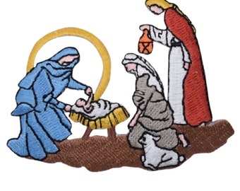 May include: An embroidered patch depicting the nativity scene. A blue-robed figure kneels beside a manger with a baby inside. A woman in a red robe holds a lantern and a woman in a brown robe kneels with a lamb beside her. A gold halo surrounds the manger.