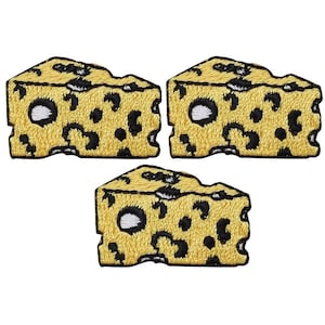 May include: Three yellow embroidered iron-on patches shaped like a wedge of Swiss cheese with black holes.