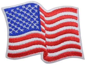 May include: A red, white, and blue embroidered American flag patch. The flag is waving in the wind.