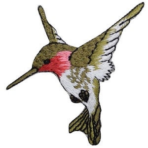 May include: Embroidered hummingbird patch. The bird is depicted in flight, with olive green, white, and red detailing. The wings are spread, and the long beak is angled downwards. This patch is suitable for application on clothing or accessories.