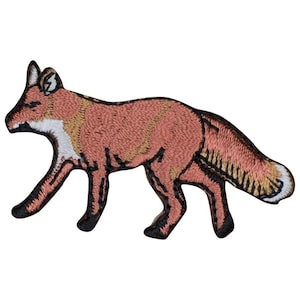 May include: An embroidered patch in the shape of a maned wolf, featuring a reddish-brown coat with black legs, a white throat patch, and a bushy tail with a white tip. The design is outlined in black thread, capturing the animal in a walking pose.