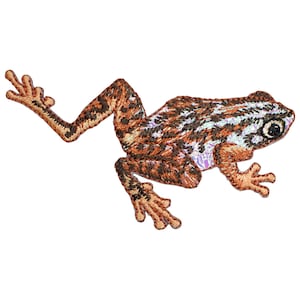 May include: An embroidered patch of a brown and orange frog with black stripes. The frog is in a jumping pose with its legs outstretched.