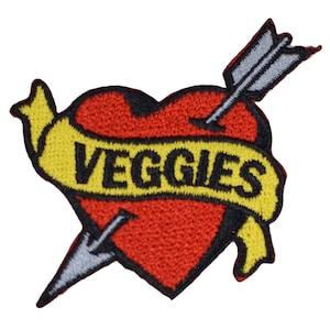 May include: A red heart with a yellow banner that says "VEGGIES" and an arrow piercing through it. The arrow is grey and has a black tip.