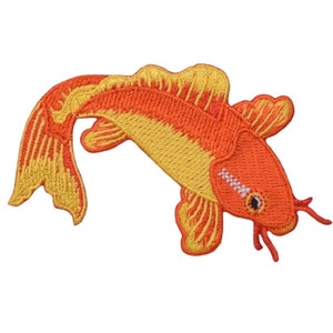 May include: Embroidered koi carp patch in orange and yellow. The fish has detailed stitching, a curved body, flowing fins, and a small eye. The patch is designed to be ironed on or sewn onto fabric, ideal for customising clothing or accessories.