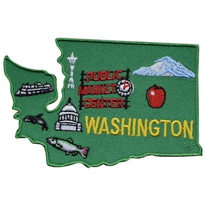 May include: Green embroidered patch shaped like the state of Washington with various icons representing the state, including the Space Needle, a ferry, a salmon, a red apple, Mount Rainier, and the Capitol Building. The text "PUBLIC MARKET CENTER" and "WASHINGTON" are also embroidered on the patch.