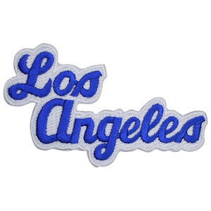 May include: Blue embroidered patch with the text "Los Angeles" in a cursive font.