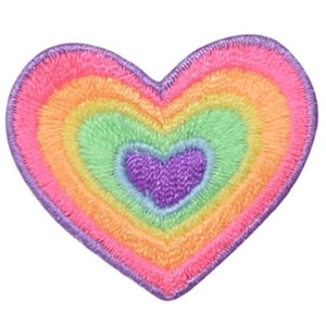 May include: A rainbow heart-shaped patch with a smaller purple heart in the center. The patch is made of embroidered fabric and has a fuzzy texture.