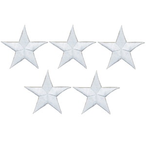 May include: Five white star-shaped embroidered patches. Each star has five points and a detailed, textured surface. The patches are arranged against a plain white background, suitable for sewing onto clothing or other fabric items.
