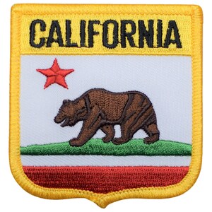 May include: A yellow embroidered patch with the words "CALIFORNIA" in black lettering. The patch features a red star, a brown bear, and a green, white, and red stripe design.