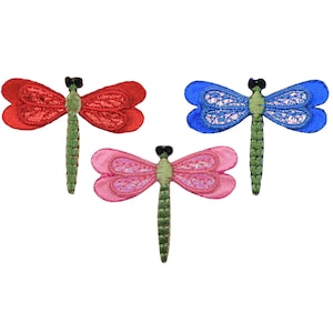 May include: Three embroidered dragonfly patches in red, pink, and blue. Each dragonfly has detailed wings and a green body. The patches are designed with a textured, stitched appearance, perfect for crafts and embellishments.