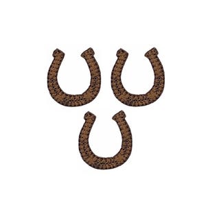 May include: Three brown horseshoe-shaped embroidered patches featuring a textured, speckled surface pattern. Each patch has a distinct U-shape with rounded ends, rendered in a dark brown thread with lighter brown highlights throughout the design.