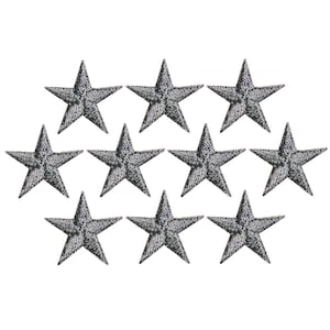 May include: Ten black embroidered star iron-on patches. The stars are a five-pointed design with a slightly distressed look.