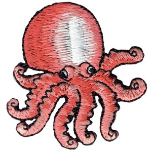 May include: A pink embroidered octopus with eight tentacles and large eyes. The octopus is a cartoon-style design.