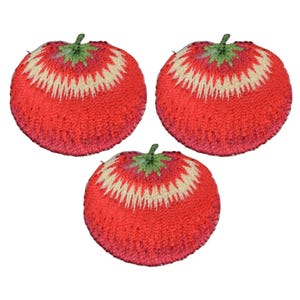 May include: Three red embroidered tomato patches with green stems and white accents. The patches are ideal for adding a touch of whimsy to crafts and projects.