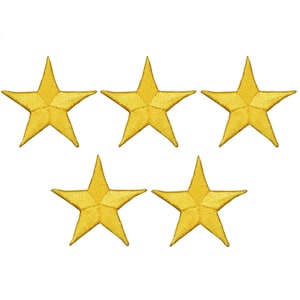 May include: Five gold star-shaped iron-on patches. The stars are a bright yellow color and have a slightly textured surface.