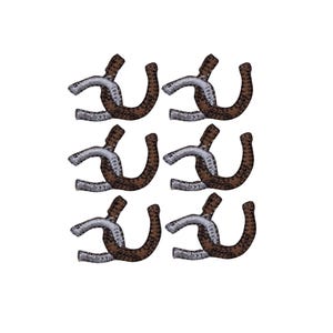 May include: A set of six embroidered patches, each featuring a horseshoe shape. Each patch consists of a silver-colored metallic-thread section intertwined with a brown, leopard-print patterned section, creating a distinct two-tone design.