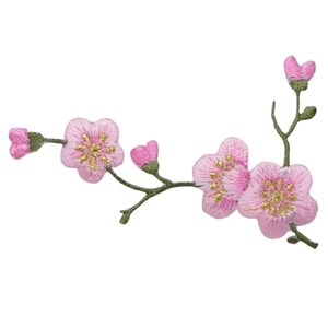 May include: Pink embroidered cherry blossom branch with gold accents. The branch has five blossoms and two buds.