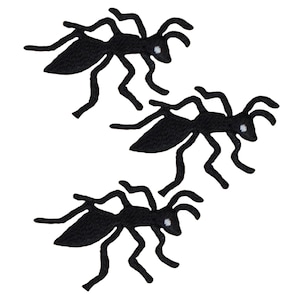 May include: Three black ant silhouettes with white eyes. The ants are in a variety of poses, with their legs outstretched.