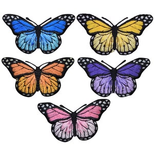 May include: Five embroidered iron-on patches of butterflies in different colors: blue, yellow, orange, purple, and pink. The butterflies have black outlines and white spots.