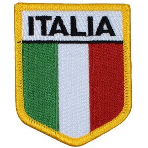 May include: A yellow embroidered patch with the Italian flag colors of green, white, and red. The word "ITALIA" is embroidered in black letters on the top of the patch.