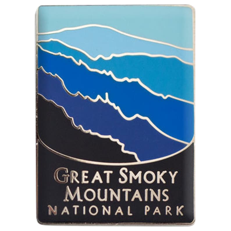 May include: A blue and black enamel pin featuring a stylized image of mountains with the text "Great Smoky Mountains National Park".