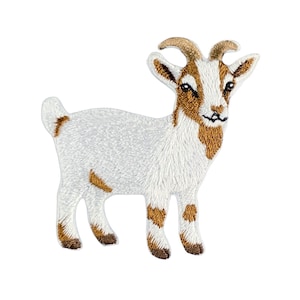 May include: An embroidered iron-on patch featuring a standing goat with white fur and light brown patches on its head, ears, legs, and tail. The goat has two small horns, pointed ears, and a detailed stitched texture throughout the entire design.