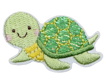 May include: A green and yellow embroidered iron-on patch of a smiling turtle with a green shell.