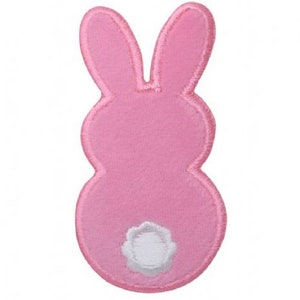 May include: Pink felt bunny applique with a white felt tail. This applique is perfect for adding a touch of whimsy to crafts and projects.