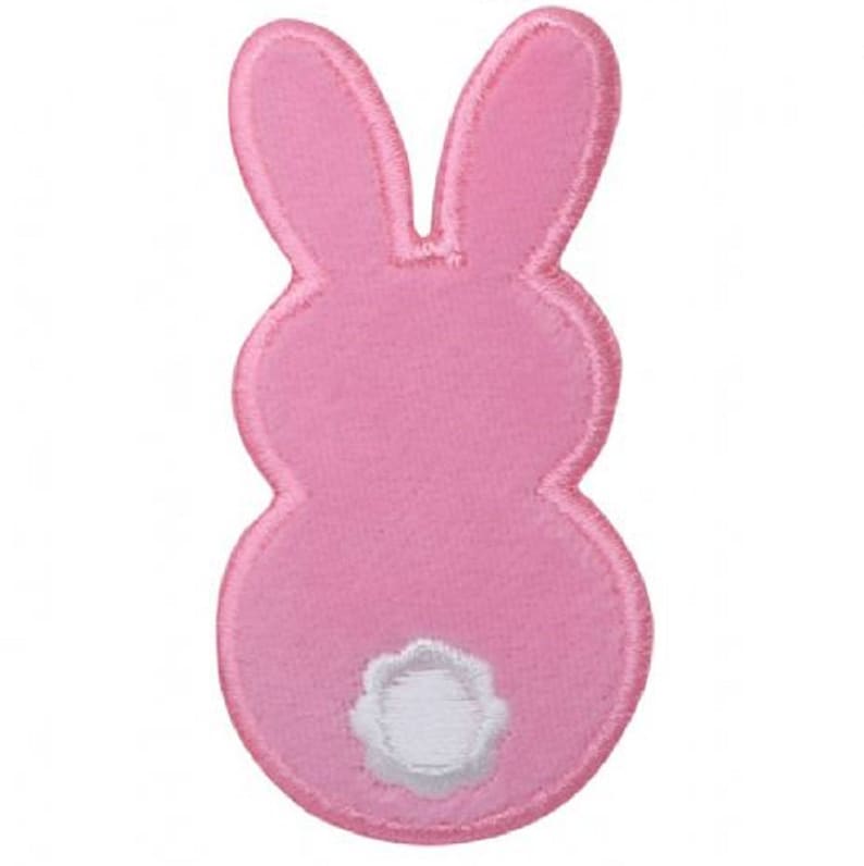 May include: Pink felt bunny applique with a white felt tail. This applique is perfect for adding a touch of whimsy to crafts and projects.