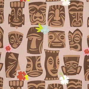 May include: A repeating pattern of brown tiki masks in various shapes and sizes on a light tan background. The masks have detailed facial features and are interspersed with colorful flowers, creating a tropical theme.