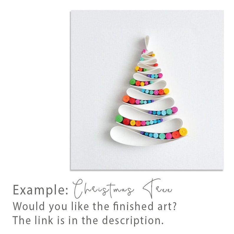 May include: A paper quilling art piece featuring a stylized Christmas tree shape. The tree is constructed from white paper strips forming horizontal layers, filled with small, tightly coiled paper rolls in vibrant rainbow colors.