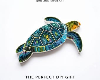 May include: A digital template for quilling paper art featuring a sea turtle design. The turtle is crafted from coiled paper strips in shades of teal, blue, green, and yellow. Text reads: DIGITAL TEMPLATE QUILLING PAPER ART THE PERFECT DIY GIFT for your loved ones.