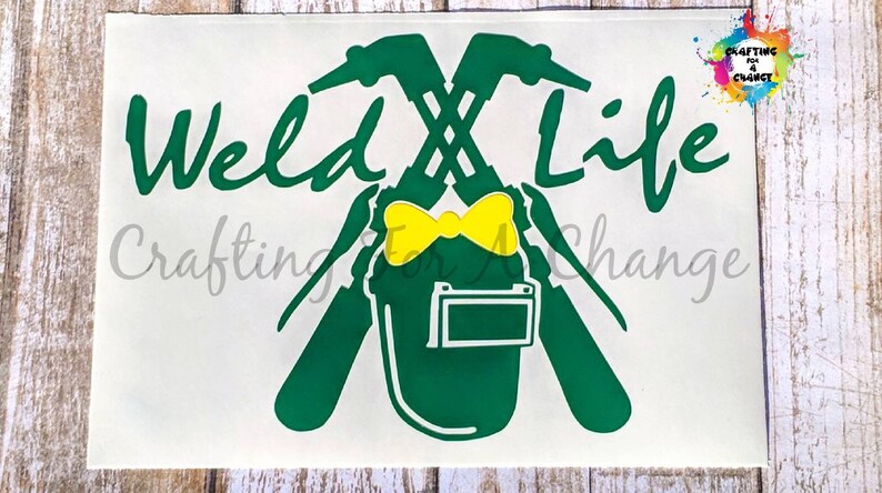 May include: Green and yellow "Weld Life" decal with a welding helmet and crossed welding torches. The decal also includes the text "Crafting for Change" and a colorful logo in the upper right corner.