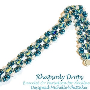 May include: A teal and white beaded bracelet with a teardrop design. The bracelet is called "Rhapsody Drops" and is designed by Michelle Whittaker. It can be used as a bracelet or a necklace.