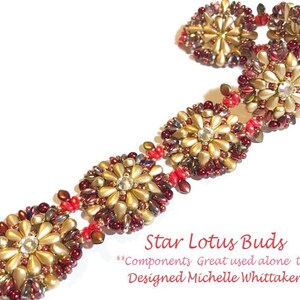 May include: A gold and red beaded bracelet with a star-shaped design. The bracelet is made with small, round beads and has a repeating pattern of star-shaped flowers. The bracelet is called "Star Lotus Buds" and is designed by Michelle Whittaker.  Components Great used alone too.