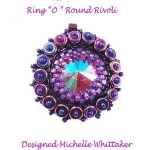 May include: A purple and iridescent beaded ring with a large round crystal in the center. The ring is designed by Michelle Whittaker.
