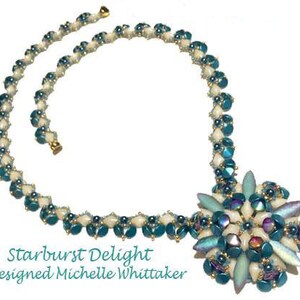 May include: A teal and white beaded necklace with a large teal and white beaded flower pendant. The necklace is called "Starburst Delight" and is designed by Michelle Whittaker.