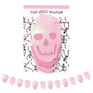 May include: Pink glitter skull bunting with a white background and the text "Pink Skull Bunting". The bunting is made of paper and has a string of pink glitter skulls hanging from it.