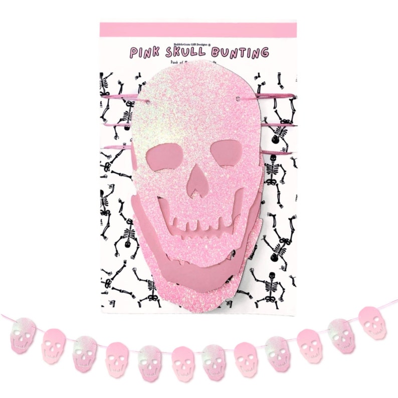 May include: Pink glitter skull bunting with a white background and the text "Pink Skull Bunting". The bunting is made of paper and has a string of pink glitter skulls hanging from it.