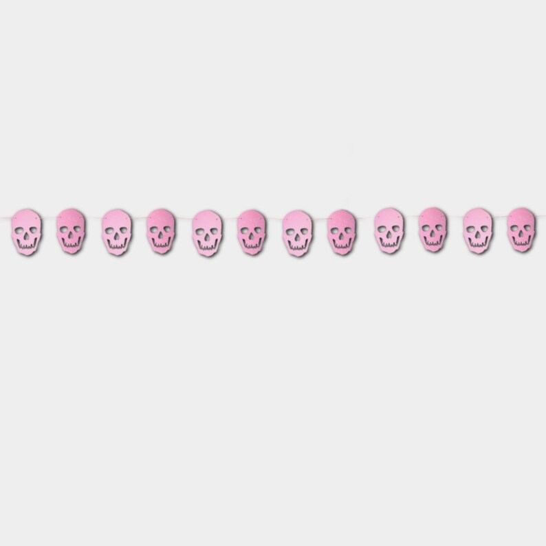 May include: A pink and white skull garland with 12 skulls. The garland is perfect for Halloween decorations.