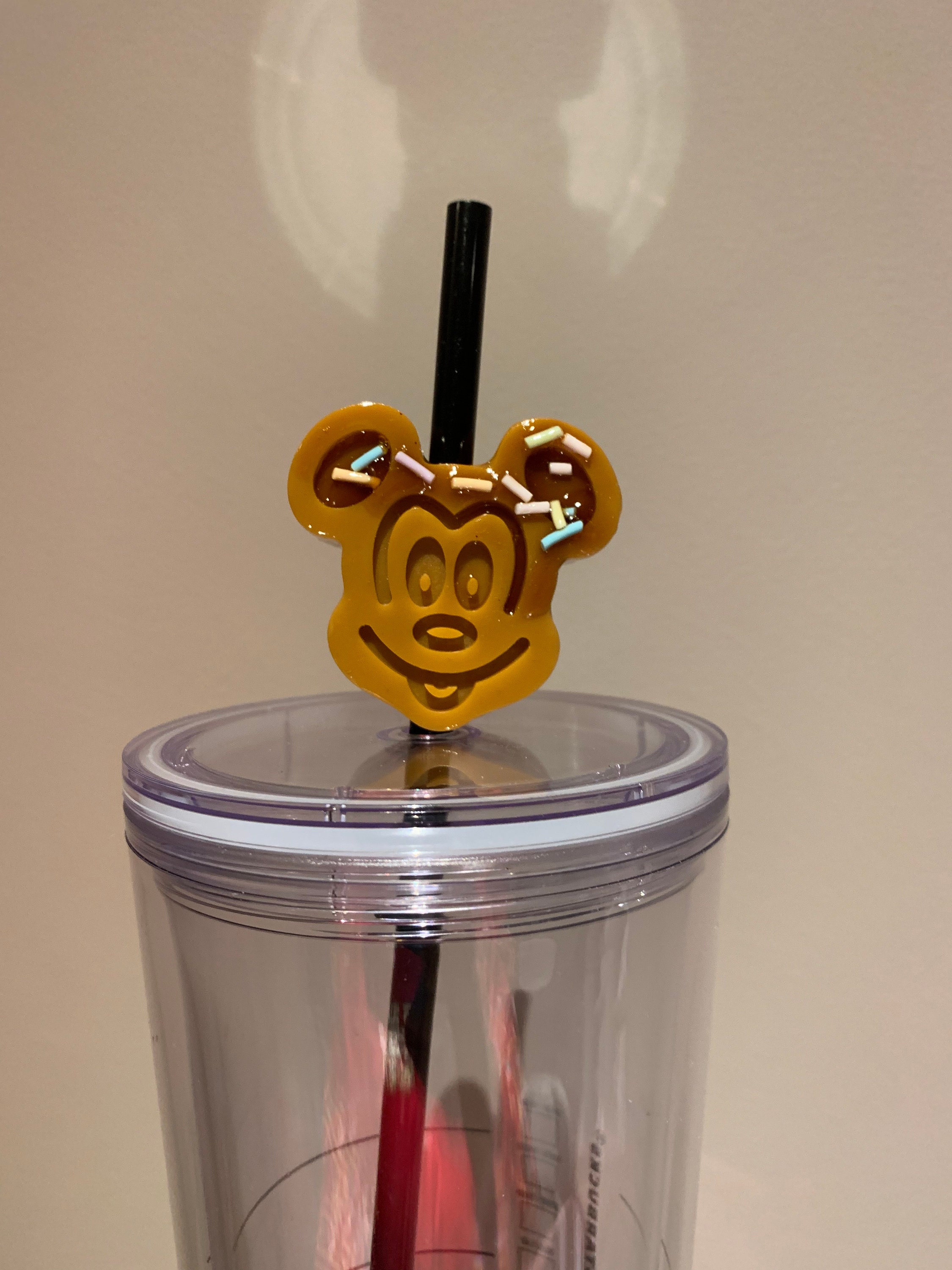 I made resin Mickey and Minnie straw toppers! Straws need flair
