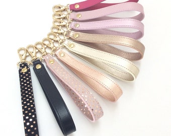 Clutch wallet with wrist strap top