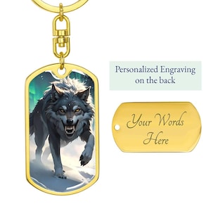May include: A gold-colored dog tag keychain featuring a detailed illustration of a snarling wolf with a snowy background. The tag includes the text "Personalized Engraving on the back" and "Your Words Here".