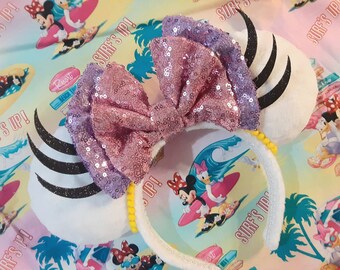 Handmade Daisy Duck Custom Mouse Ears inspired by Disney. Daisy duck ears headband.