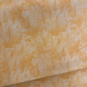 Chalk texture light orange 45”. Great for any kid blanket, pillow case!!    Great background fabric for any quilt
