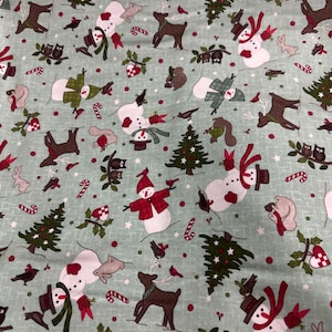 Snowtop Mountain Flannel 45” amazing light blue with snowmen squirrels and trees quilt quality fabric.  Maywood Studio MASF11162-Q