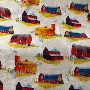 May include: A beige fabric with a repeating pattern of red barns with white windmills. The barns have white trim and some have a silo. The background is a light beige with a subtle texture.