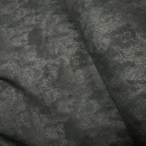 May include: Close-up of a dark gray fabric with a textured, mottled appearance. The material has a slightly distressed look, with variations in tone creating a sense of depth and visual interest. The fabric is folded, revealing its thickness and drape.