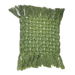 May include: A square, olive green macrame coaster with a woven pattern and fringe trim. The handmade coaster is designed to protect surfaces from heat and moisture. The macrame design adds a touch of bohemian style.